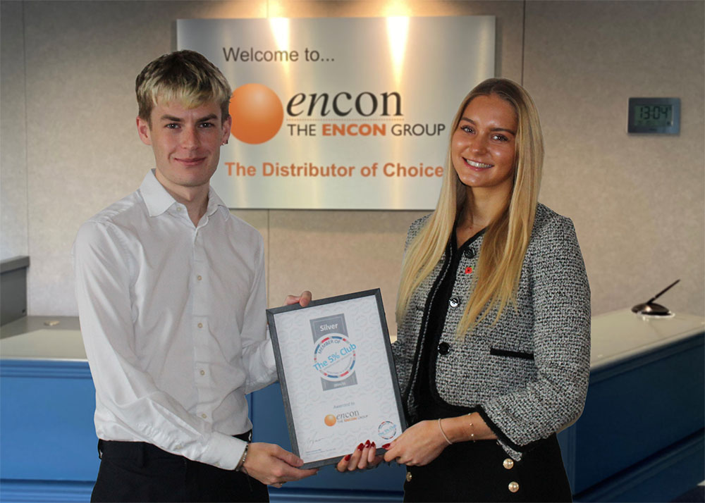 Current earn and learn employees, Jonathan Middleton and Jasmine Keith, hold Encon's Silver 5% Club certificate